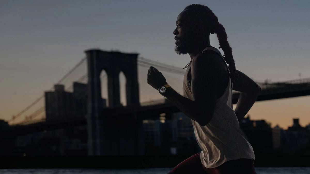 A runner wearing the Garmin Forerunner 965 smartwatch.