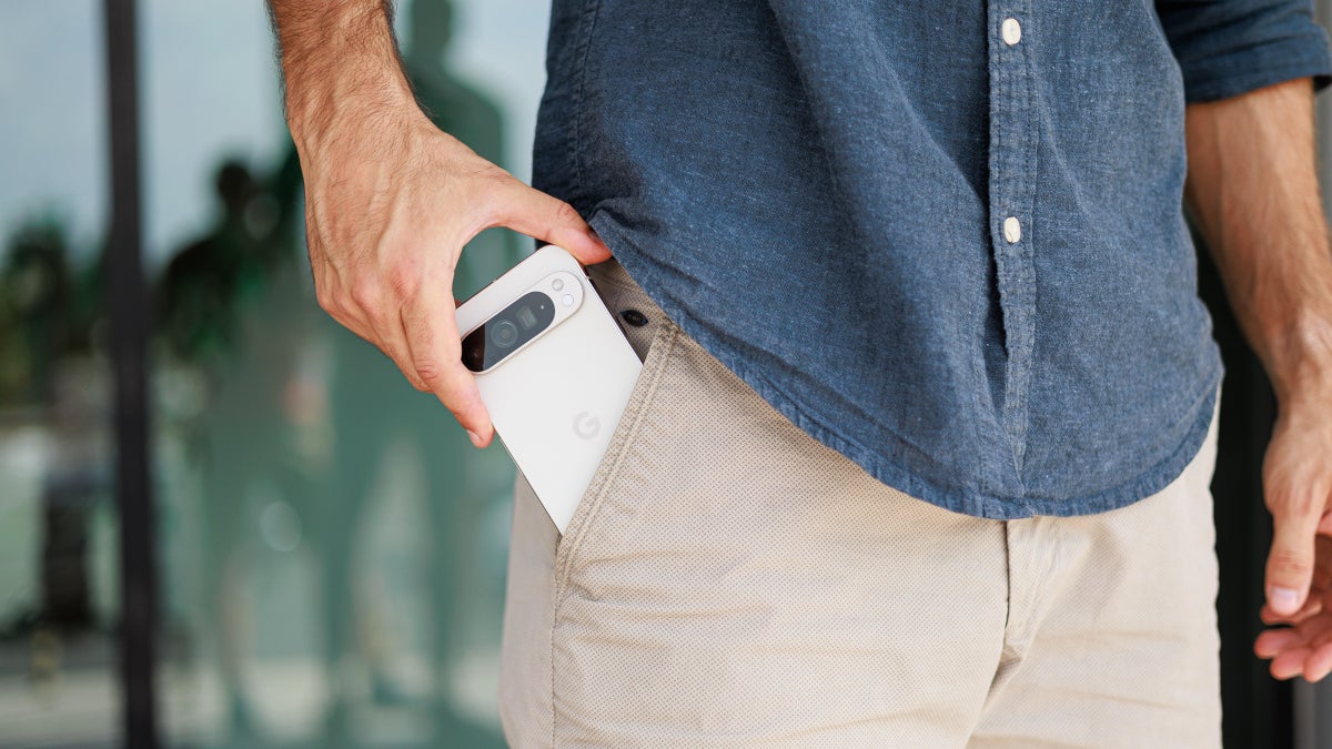 The Google Pixel 9 Pro XL is placed inside the pants pocket of Phjone Arena writer Vic.