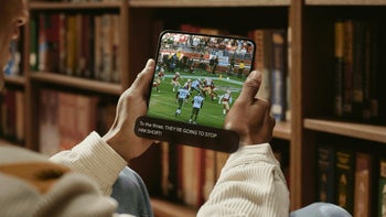 An image of a sports broadcast on a foldable device displaying expressive captions