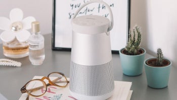 A white Bose SoundLink Revolve+ II  placed on a table.