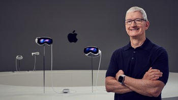 Apple CEO Tim Cook stands next to an Apple Store display of the Vision Pro .