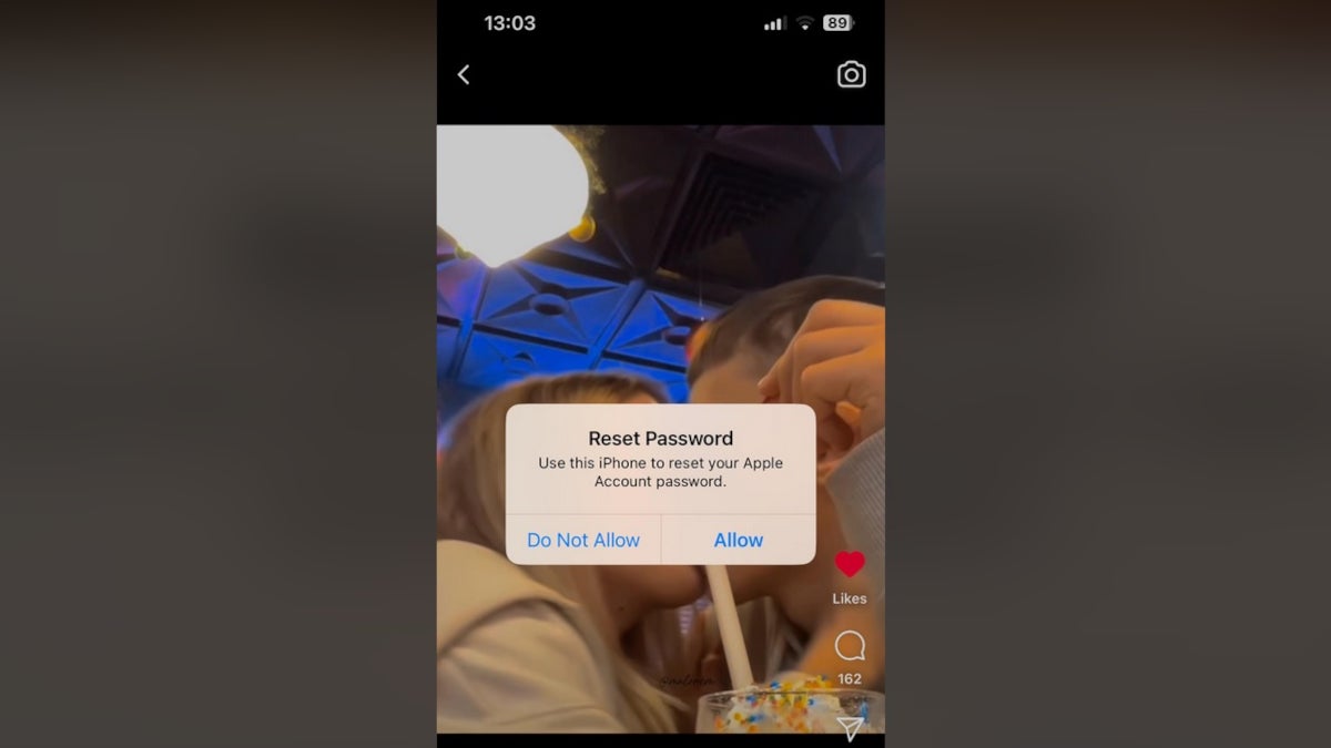 The "Reset Passwords" notification pop up appears on the screen of an iPhone.