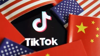 The TikTok app logo surrounded by American and Chinese flags.