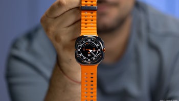 A person holding a Galaxy Watch Ultra.