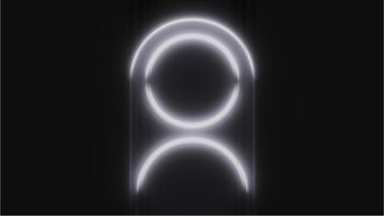 Two white glowing circles next to each other on a black background.