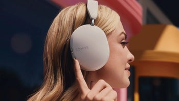 A woman wearing a pair of Sonos Ace headphones.