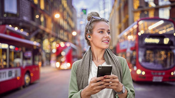 A woman wearing a pair of Jabra Elite 10 Gen 2.