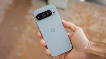 A person holds the Pixel 9 Pro, showcasing its rear camera design.