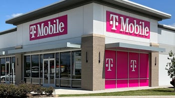 A T-Mobile retail store sits in the corner of a shopping mall.