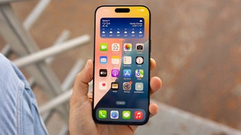 The iPhone 16 Pro Max in a person's hand with its display facing the viewer.