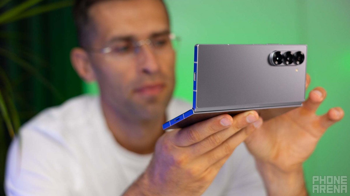 The Galaxy Z Fold 6 in Flex mode held by a person.