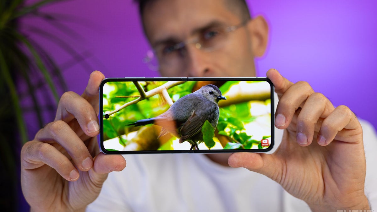 A close-up of a person holding the Galaxy Z Flip 6.