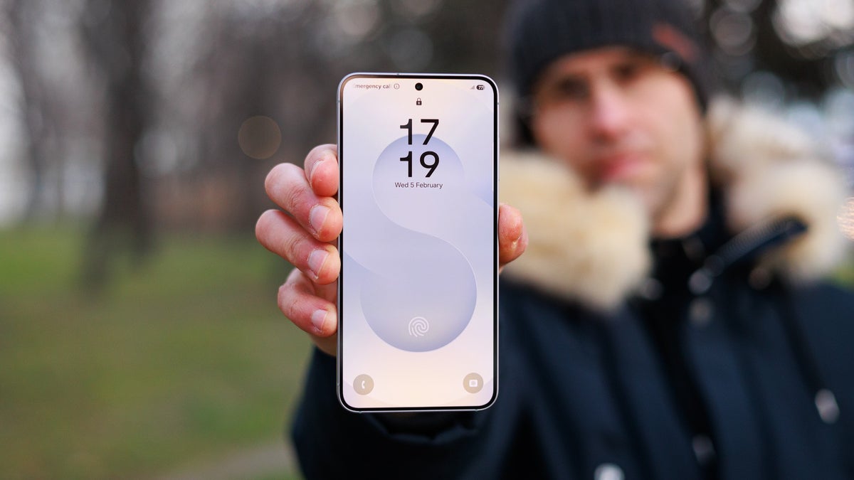 A person holds the Galaxy S25, showcasing its display.