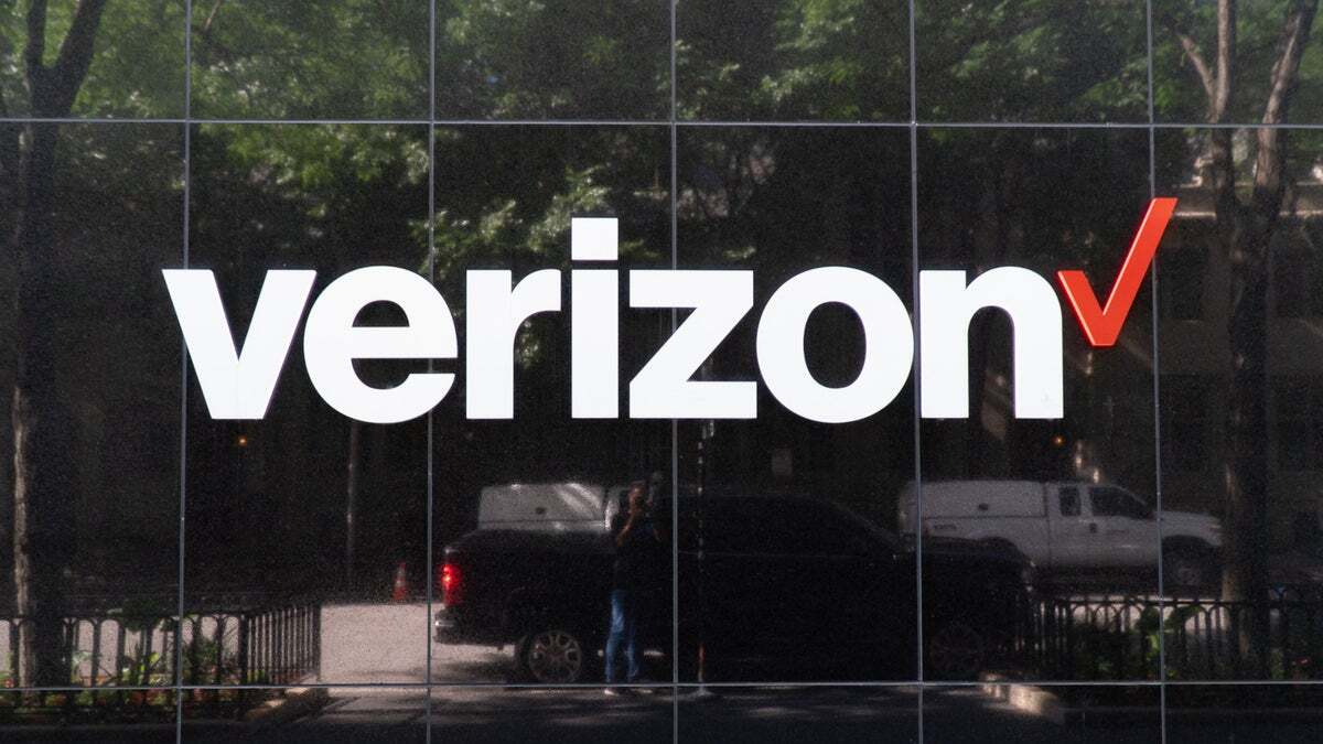 Verizon's logo on a store as seen from outside.