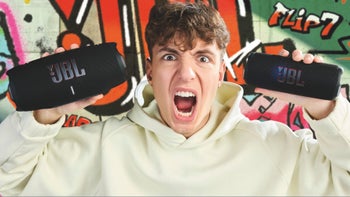 A photo of a young person holding the new JBL Charge 6 and the Flip 7 speakers in their hands.