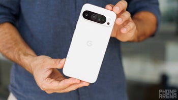 A person holding a Pixel 9 Pro XL with both hands.