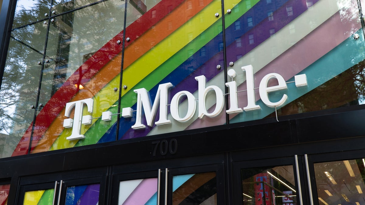 A photo of a T-Mobile store front with the company's logo on display.