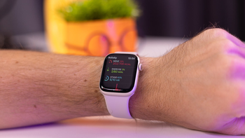 Apple Watch Series 8 on a wrist, displaying workout metrics on its touchscreen..