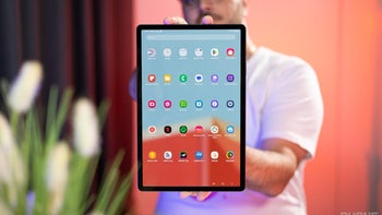 A person holding a Galaxy Tab S9+.