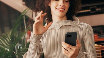 Marketing image of a person holding a Google Pixel 9a