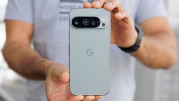 The Pixel 9 Pro XL is held with the rear panel facing the camera.