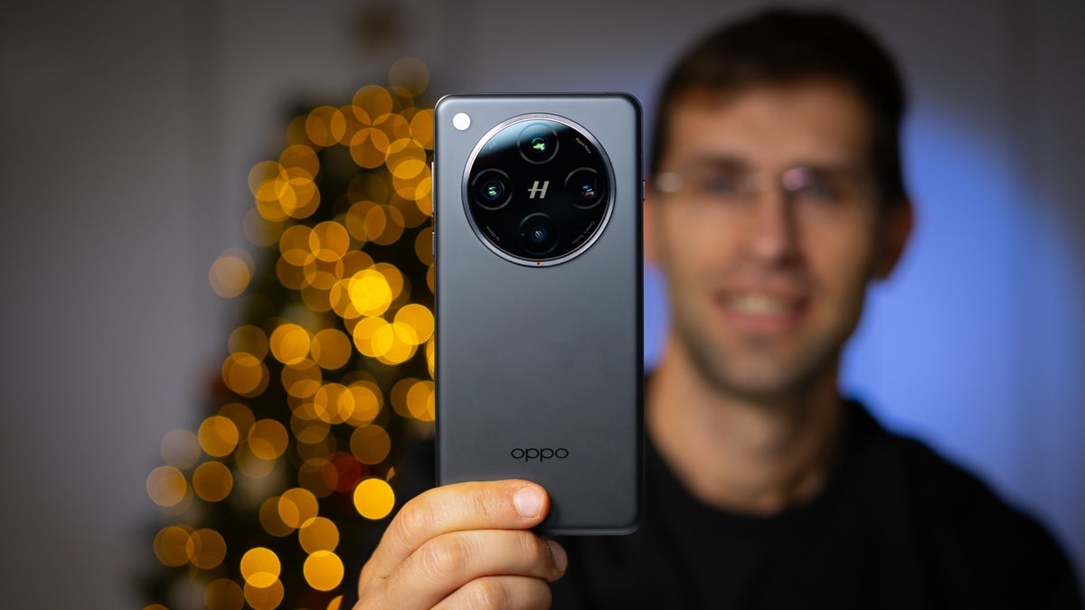 A person holding the Oppo Find X8 Pro in their hands.