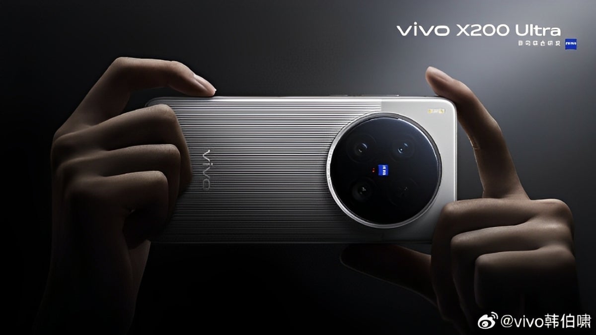 Two hands holding a silver Vivo X200 Ultra smartphone horizontally, showcasing its large circular camera module.
