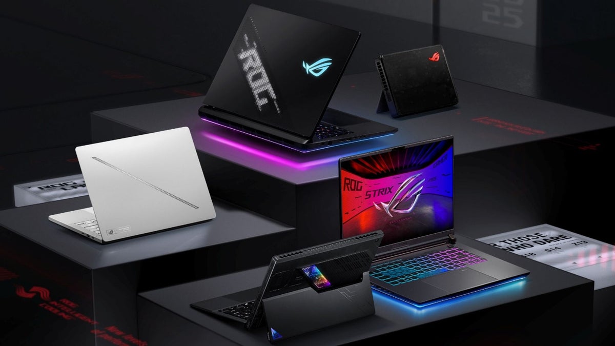 A collection of Asus ROG gaming laptops on display.