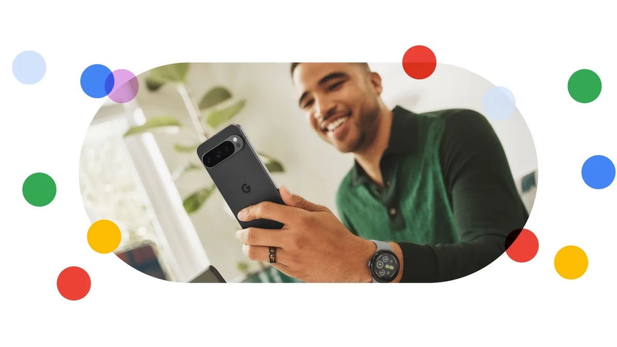 Image of a male holding up a Google Pixel 9 series smartphone