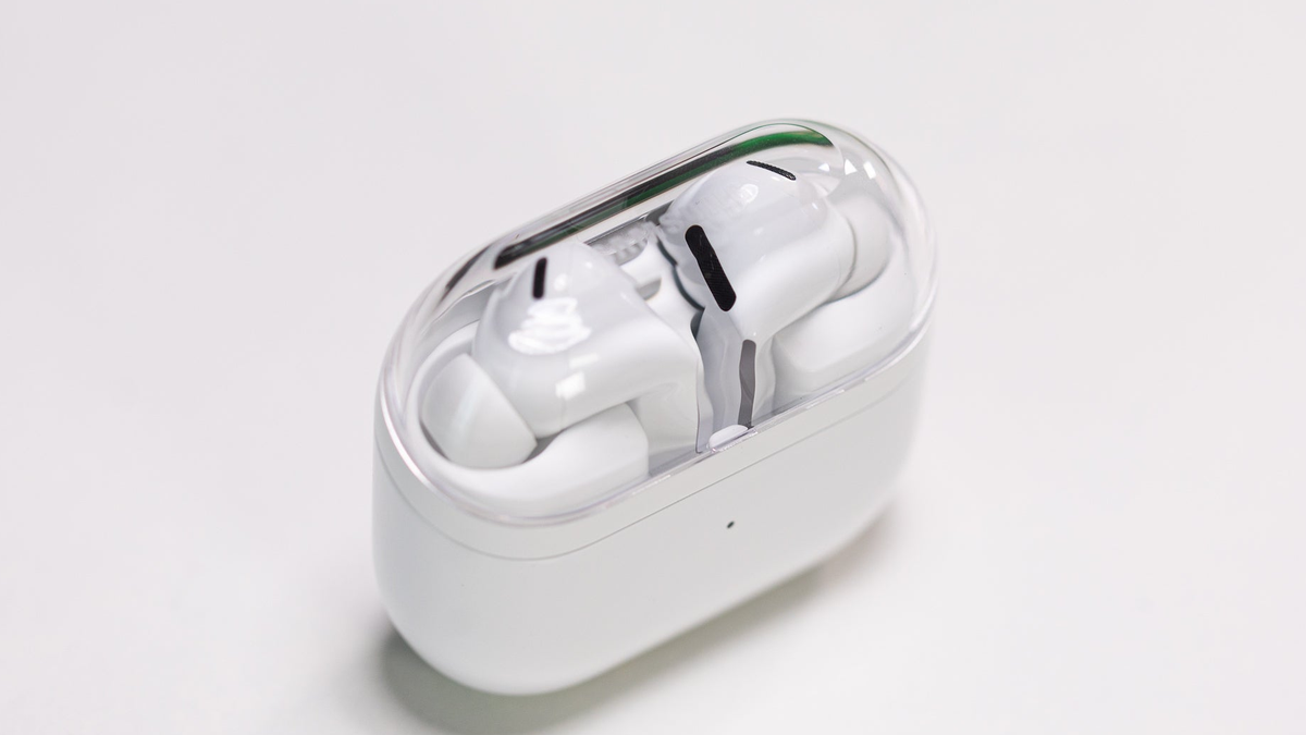 Galaxy Buds 3 Pro placed on a white table inside their charging case.