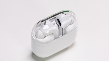 Galaxy Buds 3 Pro placed on a white table inside their charging case.