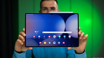 A person holding a Galaxy Tab S10 Ultra.