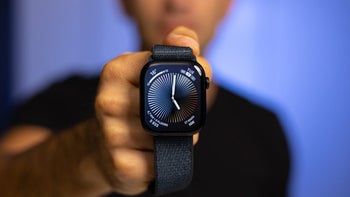 A person holding an Apple Watch Series 10.