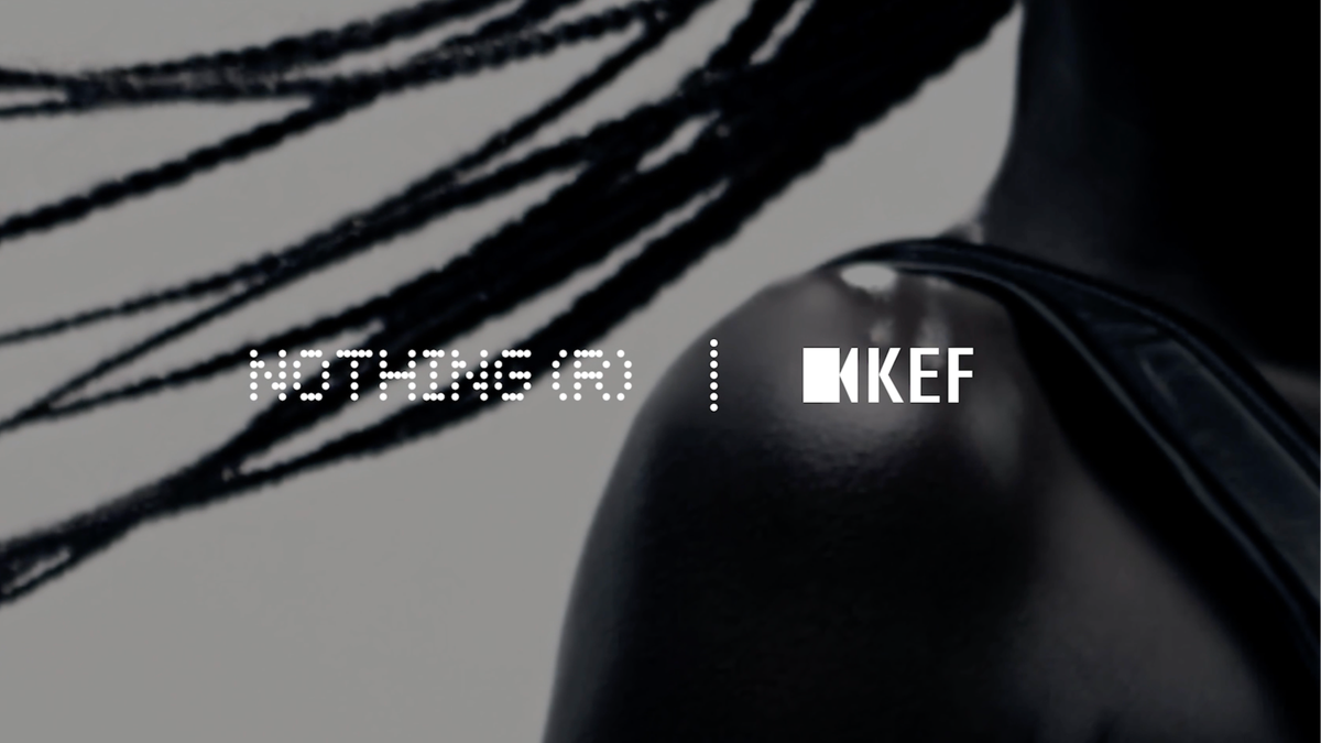 The logos for "NOTHING (R)" in a dotted, futuristic font and "KEF" in a solid, sans-serif font are displayed side-by-side with a vertical line separating them. The background is a blurred, monochromatic image of a person.