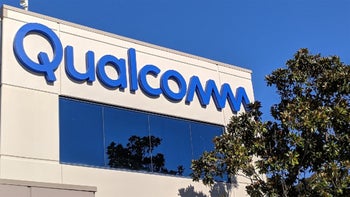 Qualcomm's logo on a building as seen from outside.