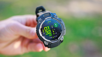 A person holds the Garmin Instinct 3, showcasing its AMOLED display and rugged design.