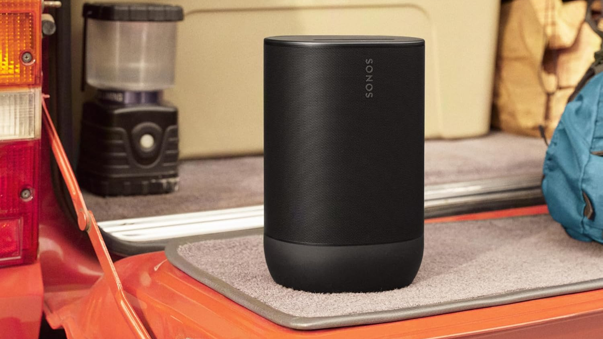 Sonos Move 2 Bluetooth speaker in an indoor environment, with a coffee maker visible in the background.