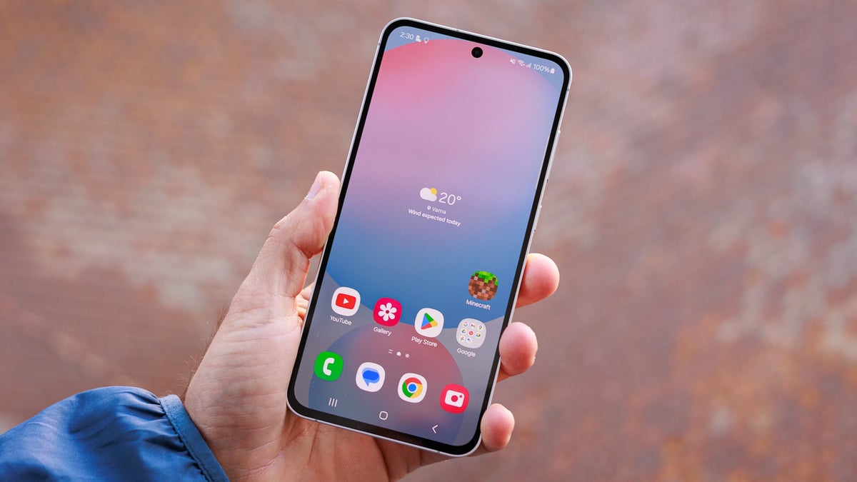 A person holds the Galaxy S24 FE in their hand, showcasing its superb display.
