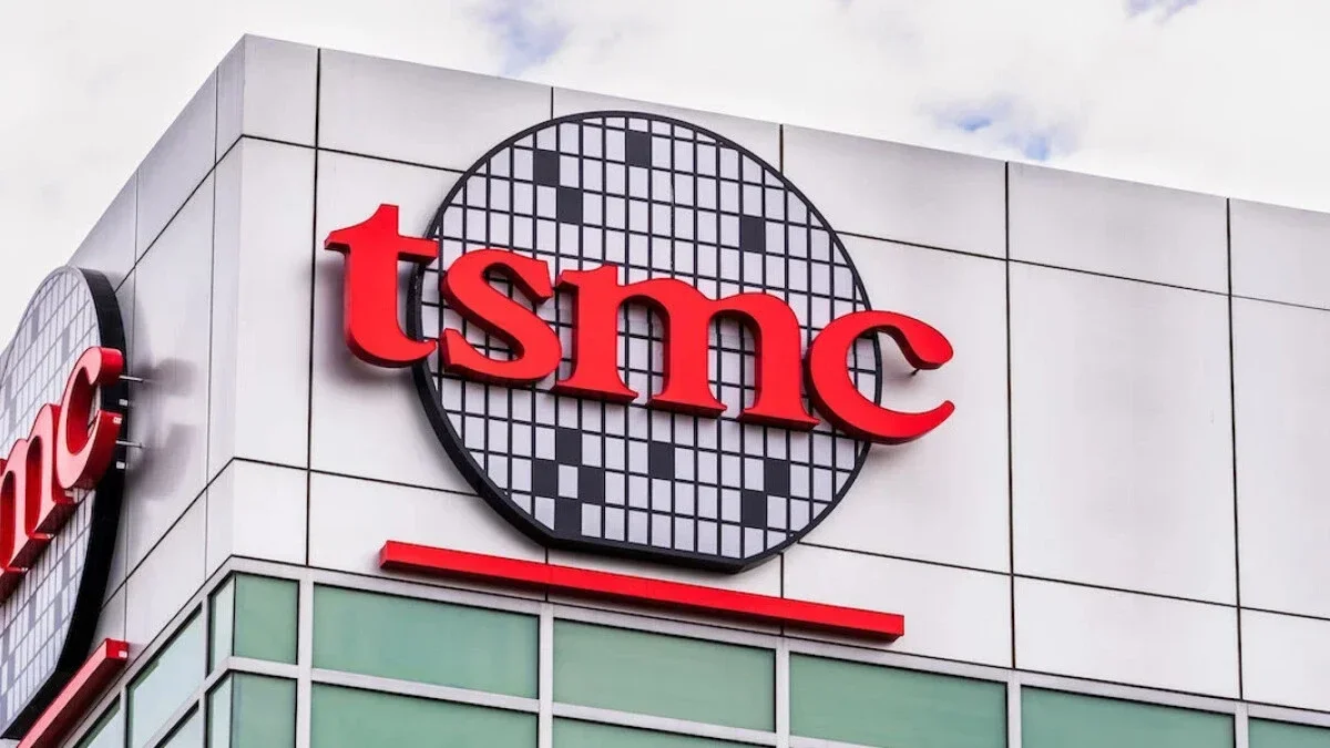 The iconic TSMC silicon wafer logo appears at the top of a company-owned building in Taiwan.