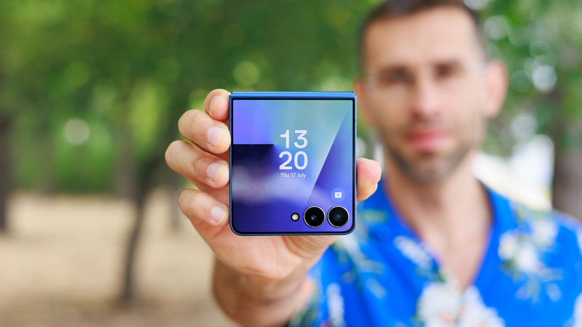 A close-up of a person holding the Galaxy Z Flip 7 folded.