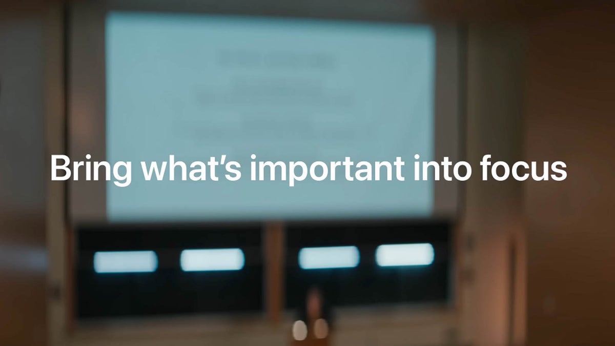 Blurred presentation screen with the text “Bring what’s important into focus” overlaid in sharp white font.