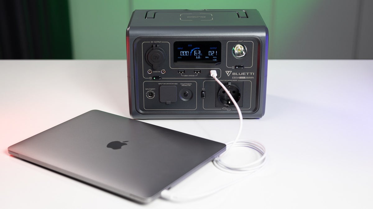 A Macbook is charged through the Bluetti EB3A.