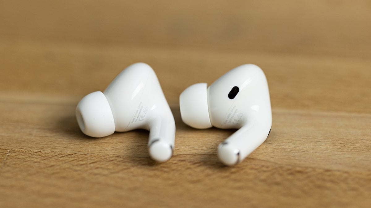 Picture of AirPods Pro 2 earbuds sitting on a desk.