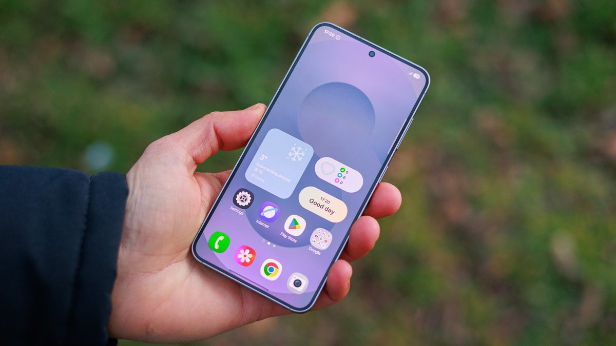 A person holds the Galaxy S25, showcasing its bright display and upgraded design.