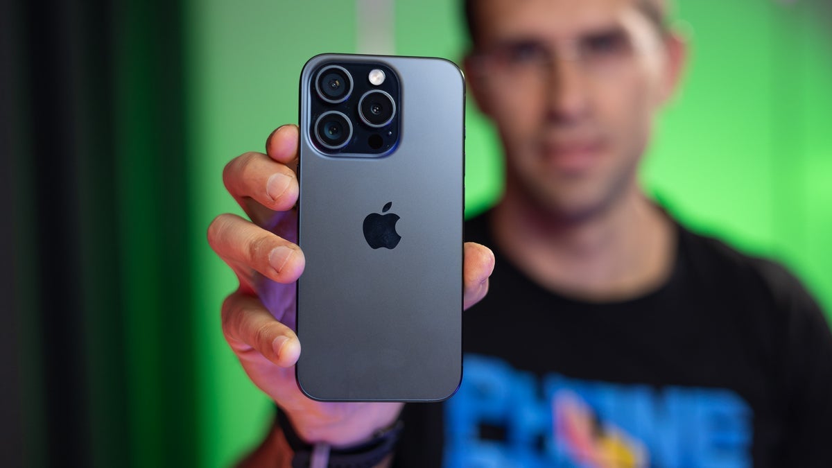 iPhone 15 Pro in a person's hand.
