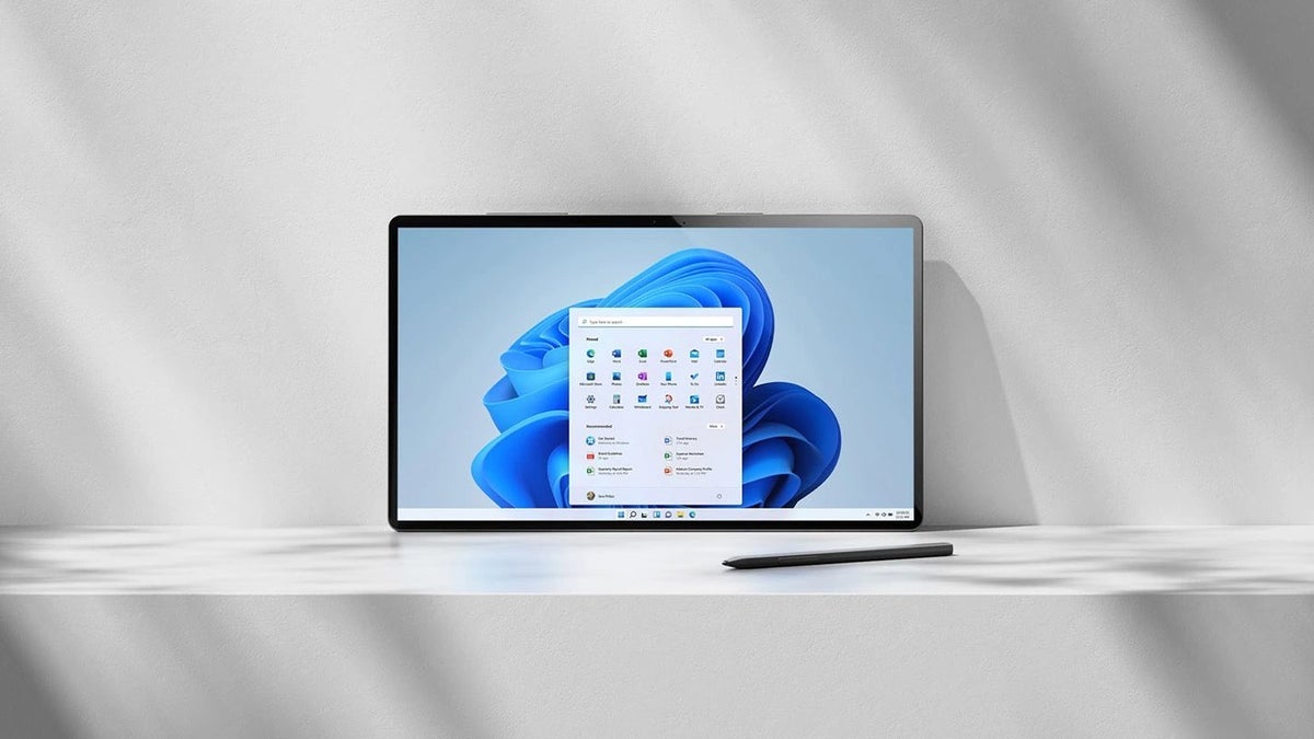 A laptop with Windows 11 on it on a desk.