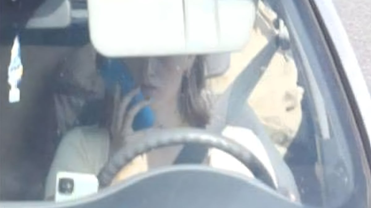 CJIB image of driver accused of holding a phone while driving