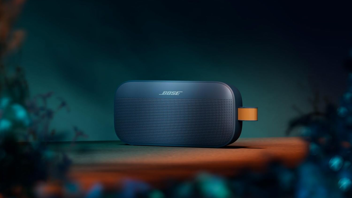 Bose SoundLink Flex (2nd Gen) in a limited-edition Twilight Blue color on a wooden table.