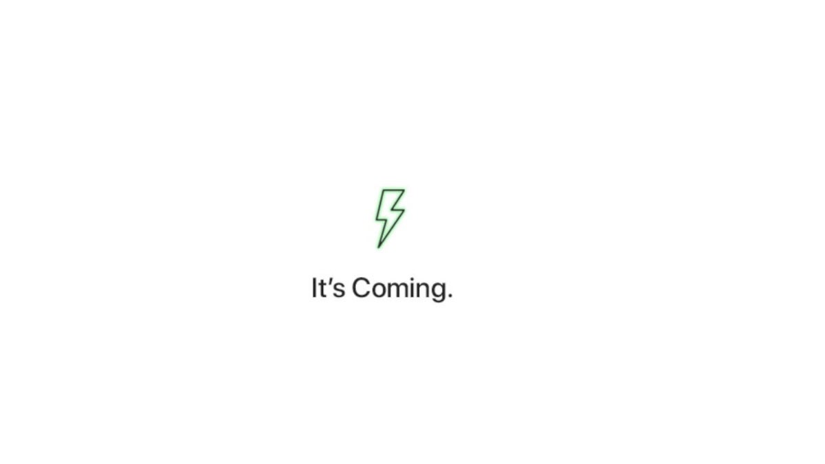 A green lightning bolt and the words It's Coming teases WPC's upcoming announcement about wireless charging.