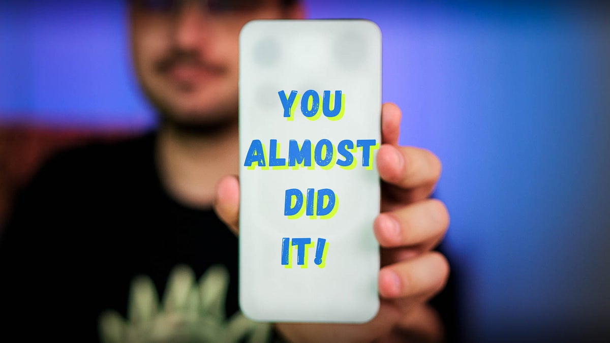 Person holding a smartphone with the words "YOU ALMOST DID IT!" displayed on the back.